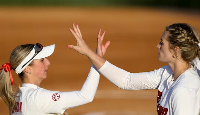 Alabama pitcher Montana Fouts (14) congratulates Alabama batter Jenna Johnson (88) after Johnson made a nice play in the outfield during Alabama s 2-1 loss in extra innings to Arkansas.